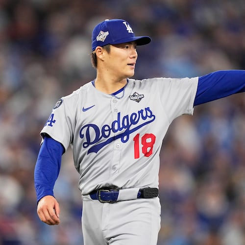 Los Angeles Dodgers pitcher Yoshinobu Yamamoto gestures during the fourth inning in Game 6 of baseball's World Series against the Toronto Blue Jays, Friday, Oct. 31, 2025, in Toronto. (AP Photo/Brynn Anderson)