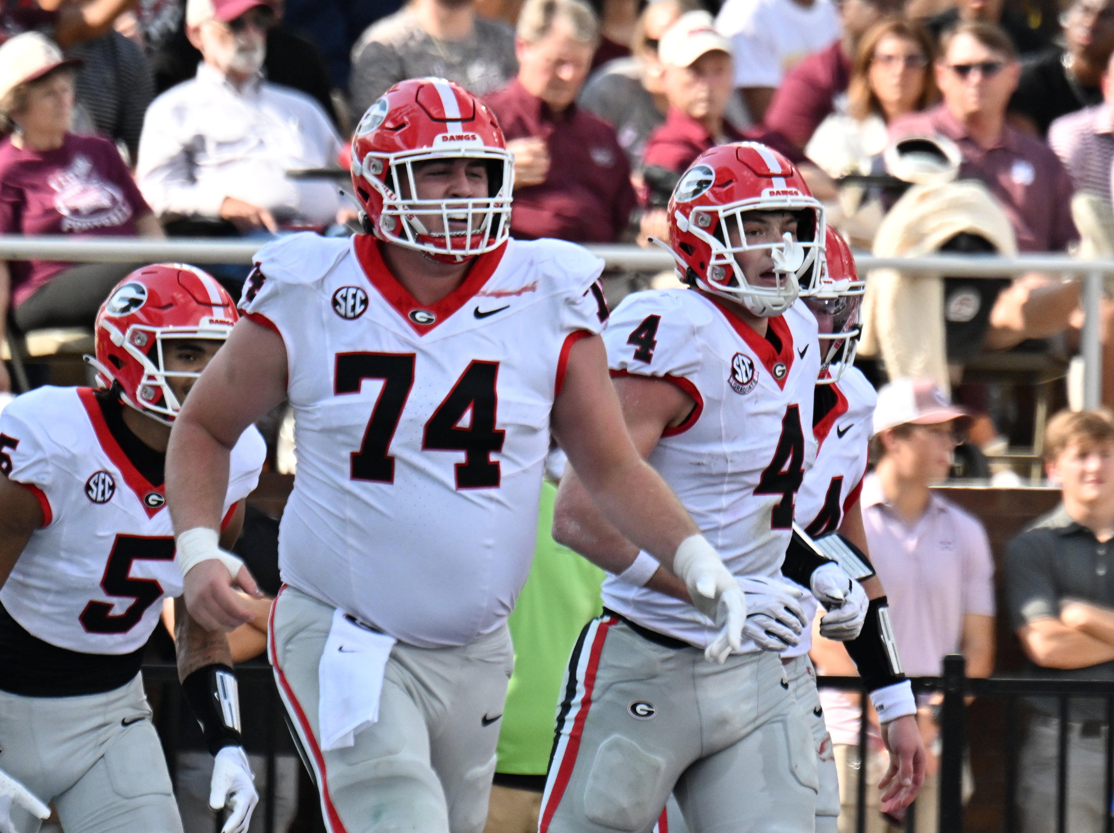 Georgia tight end Oscar Delp (4) celebrates with teammates after scoring a touchdown during the first half in an NCAA football game at Davis Wade Stadium, Saturday, November 8, 2025, in Starkville, Mississippi. (Hyosub Shin / AJC)