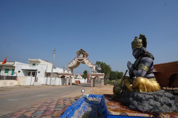 FILE - A statue of Monkey God Hanuman, installed as part of a religious celebrations, is seen in front of an entrance gate of Dingucha village in Gandhinagar, India, Tuesday, Nov. 12, 2024. (AP Photo/Ajit Solanki, File)