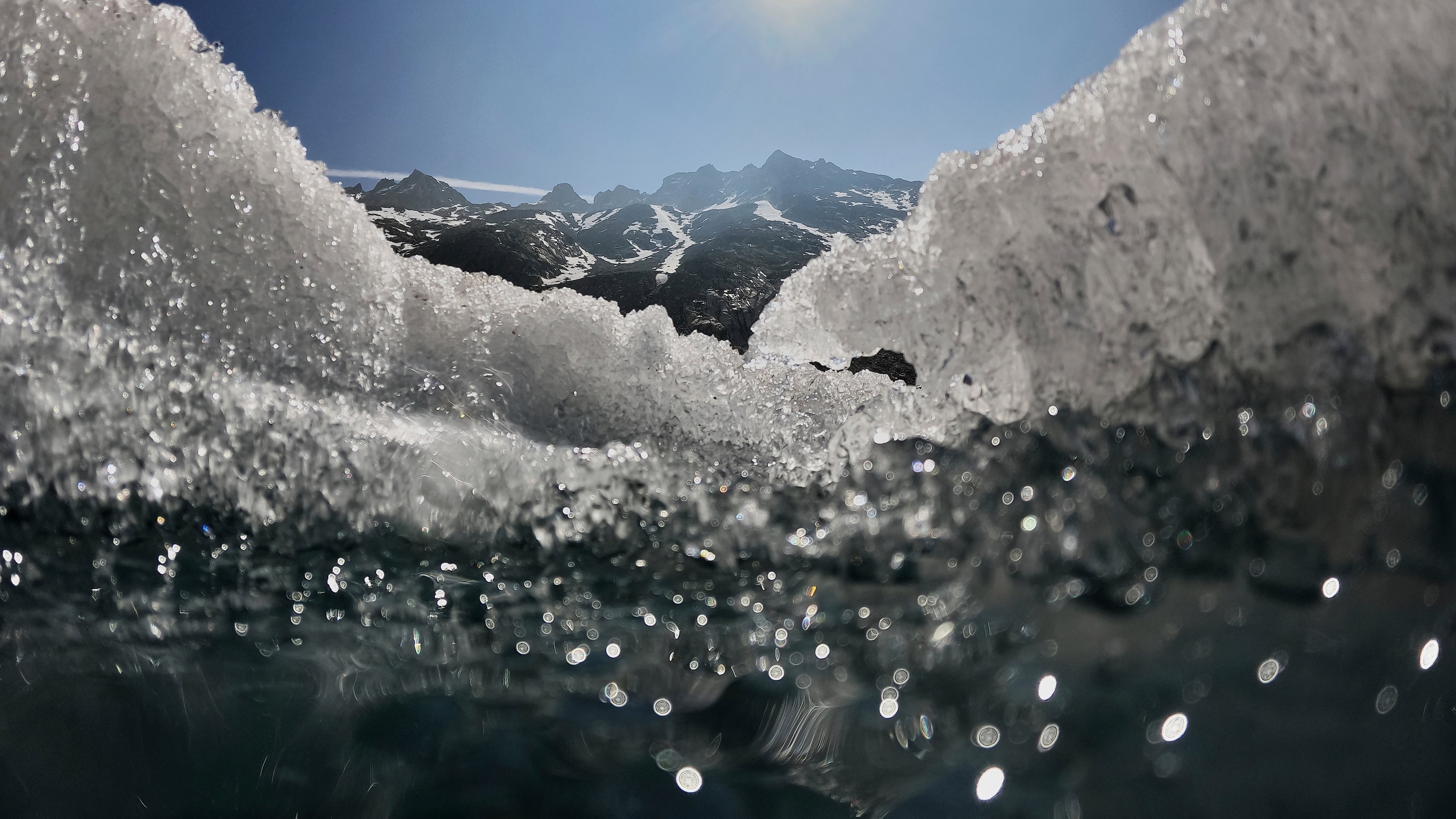FILE - The sun shines over the melting Rhone Glacier near Goms, Switzerland, on June 10, 2025. (AP Photo/Matthias Schrader, File)