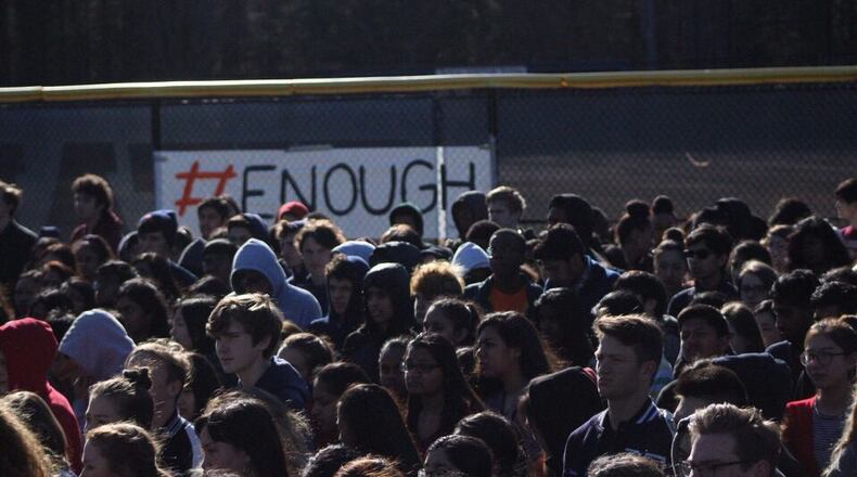 Students gather outside Northview High School in Johns Creek to participate in nationwide school walkouts that took place Wednesday. Fulton County Schools softened its initial stance and allowed students to participate, though district officials still don't call the activity a "walk out."