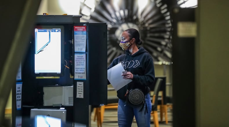 Mara Braziel votes in January at Georgia Tech's McCamish Pavilion. (John Spink / John.Spink@ajc.com)