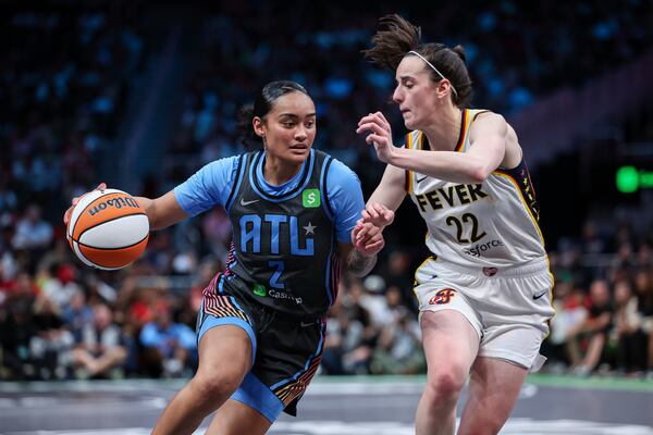Atlanta Dream guard Te-Hina Paopao (2) drives to the basket against Indiana Fever guard Caitlin Clark (22) in the second half of an WNBA basketball game, Thursday, May, 22, 2025, in Atlanta. (AP Photo/Colin Hubbard)