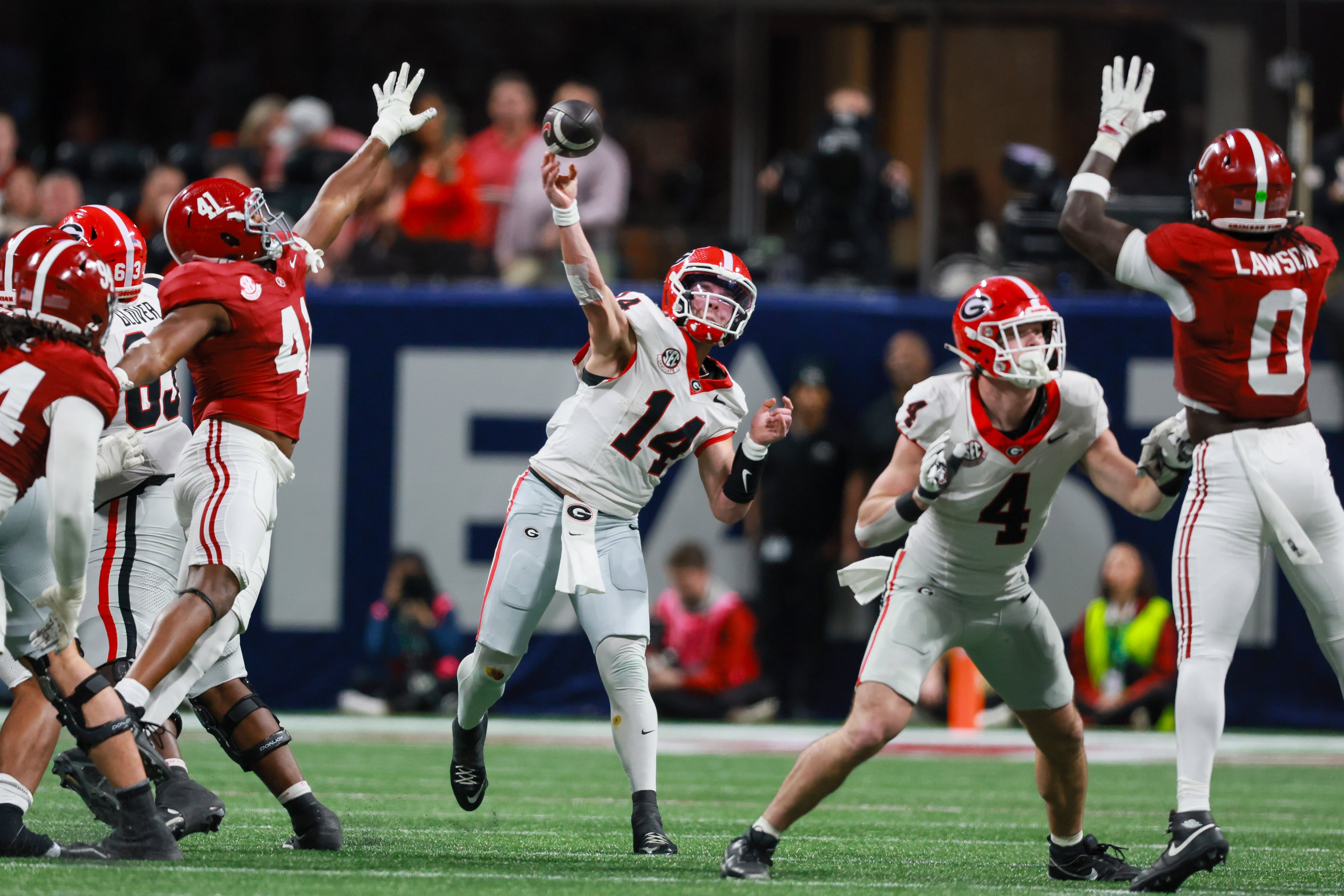 Georgia quarterback Gunner Stockton (14) throws downfield against Alabama during the fourth quarter of the SEC Championship game at Mercedes-Benz Stadium, Saturday, Dec. 6, 2025, in Atlanta. (Jason Getz / AJC)
