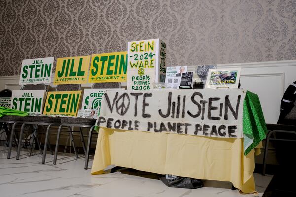 Signs for presidential candidate Jill Stein are displayed at a rally in Michigan.