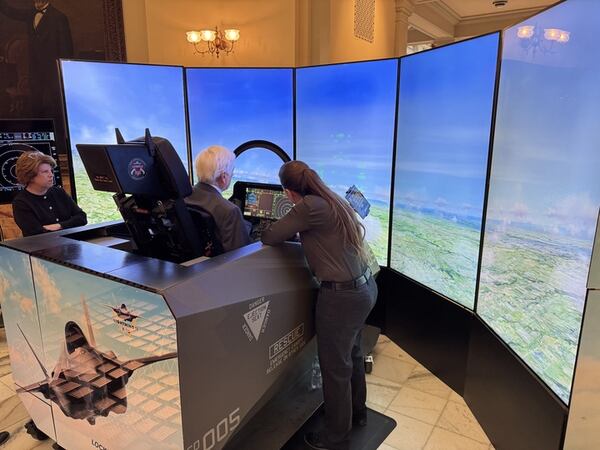 People took turns operating a F-35 simulator at the Capitol in Atlanta on Tuesday. (Adam Beam/AJC)