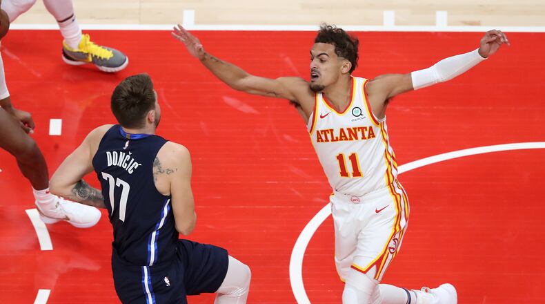 020321 Atlanta: Atlanta Hawks guard Trae Young defends against Dallas Mavericks guard Luka Doncic during an NBA basketball game on Wednesday, Feb 3, 2021, in Atlanta. Curtis Compton / Curtis.Compton@ajc.com”