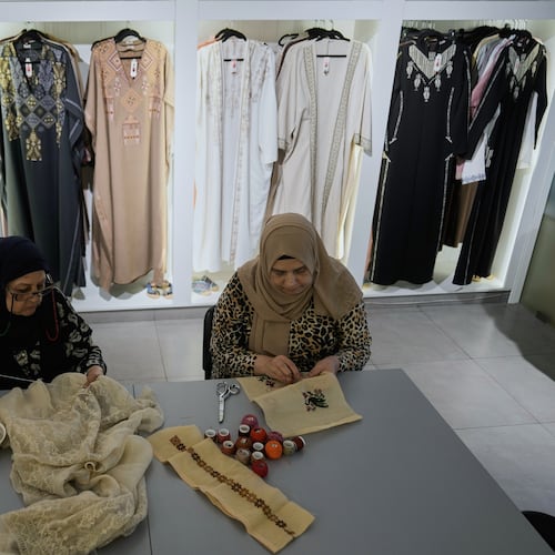 Palestinian weavers Rula Barakeh, right, and Samira Nasser work on handmade embroidered pieces at the Inaash Association embroidery workshop in Beirut, Tuesday, May 19, 2026. (AP Photo/Bilal Hussein)