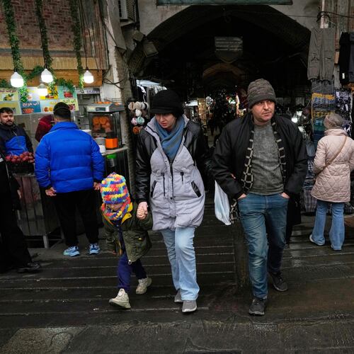 People walk at Tehran's historic Grand Bazaar, Tuesday, Jan. 20, 2026, in Iran. (AP Photo/Vahid Salemi)