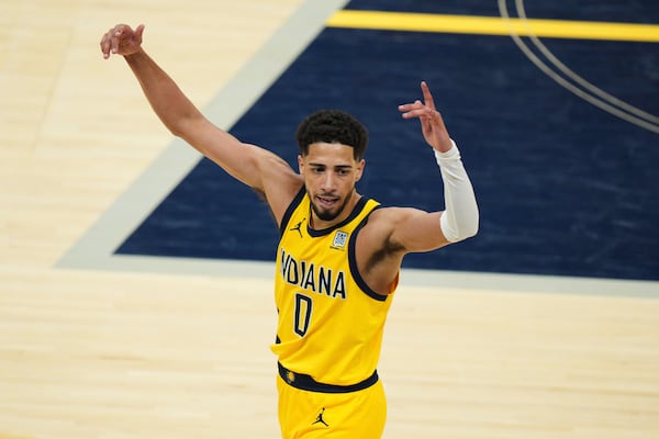 Indiana Pacers guard Tyrese Haliburton celebrates after a teammate made a 3-pointer during the second half of Game 6 of the Eastern Conference finals of the NBA basketball playoffs against the New York Knicks in Indianapolis, Saturday, May 31, 2025. (AP Photo/AJ Mast)