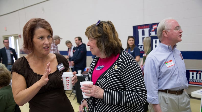 State Rep. Betty Price, center, talks with Meredith Pierard as Price’s husband, former U.S. Rep. Tom Price, stands nearby during this month’s 6th Congressional District BBQ Roundup in Roswell. STEVE SCHAEFER / SPECIAL TO THE AJC