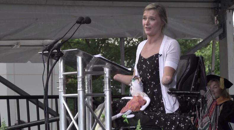 Aimee Copeland, a Gwinnett native who underwent amputations after contracting a flesh-eating bacteria in 2012, delivered the commencement address at Georgia Gwinnett College on Thursday. (YouTube screengrab)