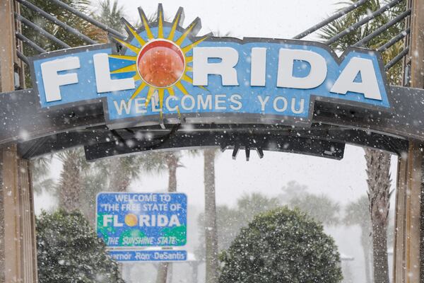 FILE - Heavy snow falls onto the Florida Welcome Center on Jan. 21, 2025 in Pensacola, Fla. (Luis Santana /Tampa Bay Times via AP, File)