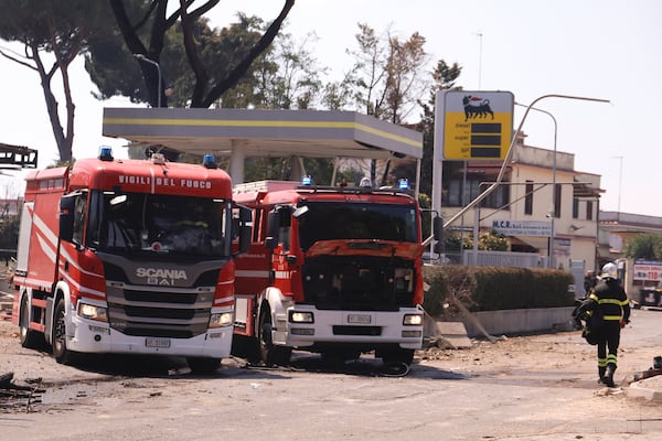 Firefighters work on a cite of a gas station explosion on the outskirts of Rome, Friday, July 4, 2025. (Cecilia Fabiano/LaPresse via AP)