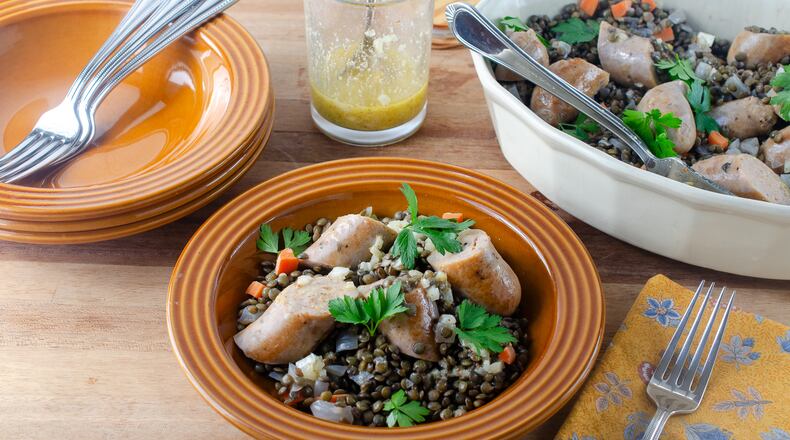 Earthy lentils and chicken sausage dressed with a mustard vinaigrette make a hearty, good and good-for-you supper. (Virginia Willis for The Atlanta Journal-Constitution)