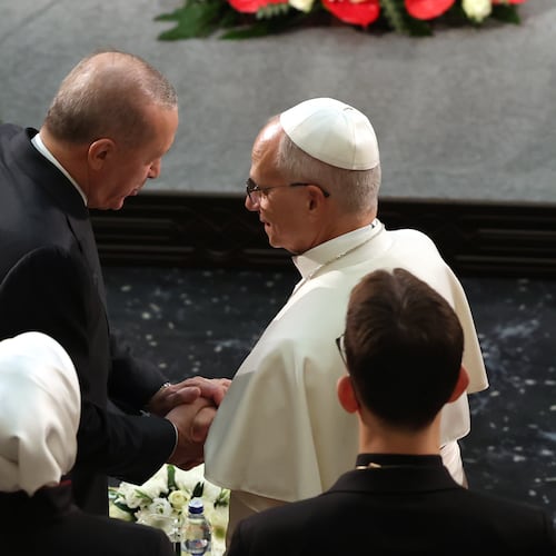 Pope Leo XIV, right, talks to Turkey's President Recep Tayyip Erdogan during a meeting with authorities, members of the civil society and diplomats in the Presidential Palace's national library, in Ankara, Turkey, Thursday, Nov. 27, 2025. (Yavuz Ozden/Dia Photo via AP)