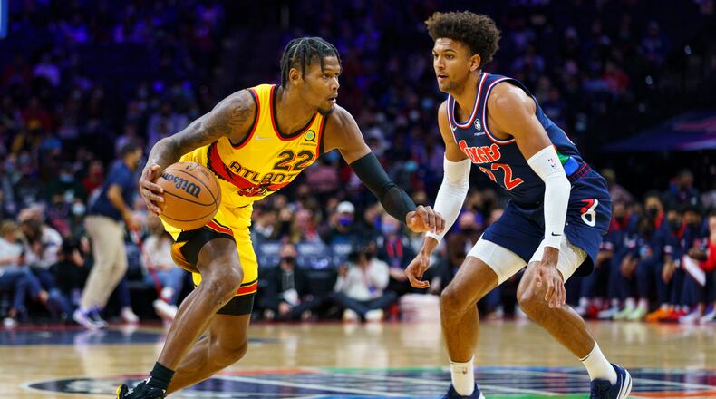 Cam Reddish makes his move against Philadelphia's Matisse Thybulle during the first half of Thursday's game in Philadelphia. (AP Photo/Chris Szagola)