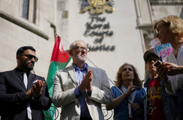 Britain's Member of Parliament Jeremy Corbyn, second left, joins demonstrators outside the Royal Courts of Justice, central London, where Palestinian human rights organization Al-Haq is taking legal action against the Department for Business and Trade over several decisions, Tuesday, May 13, 2025. (Ben Whitley/PA via AP)