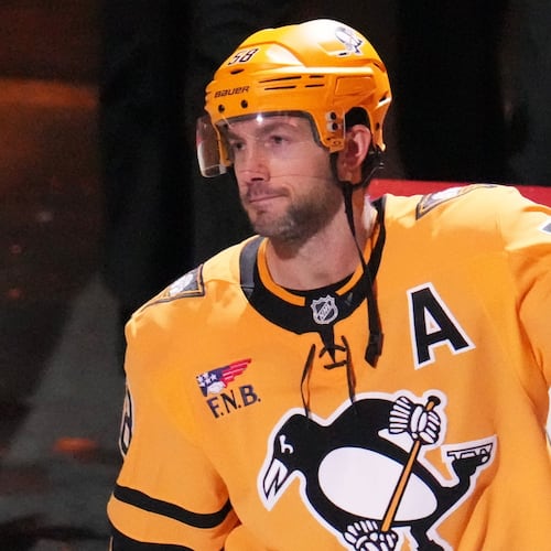 Pittsburgh Penguins' Kris Letang acknowledges being named the games number one start after scoring the gamin-winning goal in the overtime period of an NHL hockey game against the Detroit Red Wings in Pittsburgh, Thursday, Jan. 1, 2026. (AP Photo/Gene J. Puskar)