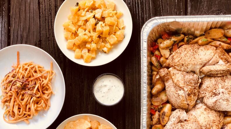 Takeout from Poor Hendrix: clockwise from left; spicy cold sesame noodles; golden beet salad; roast chicken with fingerling potatoes and garlic lemon aioli (center); salmon tartare with chips. Contributed by Wendell Brock