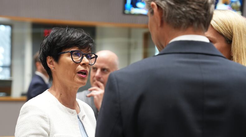 European Commissioner for Enlargement Marta Kos, left, speaks with Lithuania's Foreign Minister Kestutis Budrys, center, and European Union foreign policy chief Kaja Kallas, right, during a round table meeting of EU foreign ministers in Brussels, Monday, July 13, 2026. (AP Photo/Marius Burgelman)