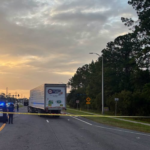 In this photo provided by the St. Johns County Sheriff's Office, the eastbound lanes of SR 16 between Outlet Mall Boulevard and Inman Road in St. Augustine, Fla., are shutdown after a fatal collision. (St. Johns County Sheriff's Office via AP)