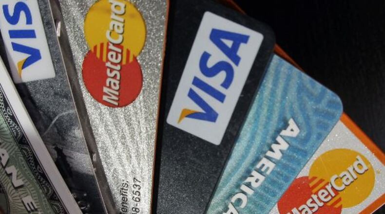 Using a fraudulent credit card scam, five people bought more than $100,000 worth of merchandise, police said.