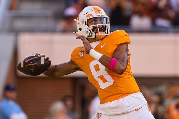 FILE - Tennessee quarterback Nico Iamaleava throws to a receiver during the first half of an NCAA college football game against Alabama, Saturday, Oct. 19, 2024, in Knoxville, Tenn. (AP Photo/Wade Payne, File)