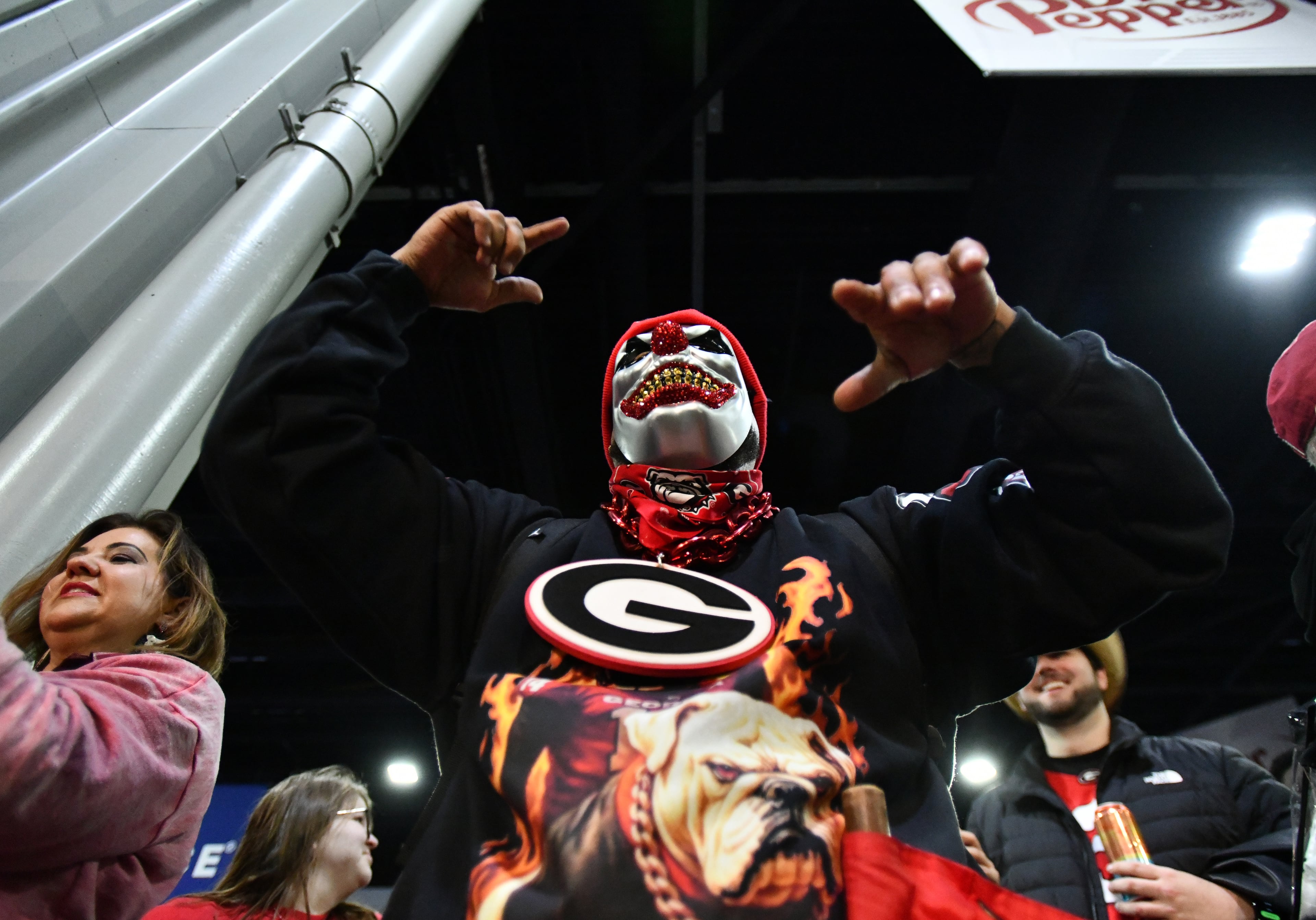 Georgia fans cheer during pep rallies at The Dr Pepper SEC FanFare ahead of the SEC Championship football game between Georgia and Alabama, Saturday, Dec. 6, 2025 in Atlanta. (Hyosub Shin/AJC)