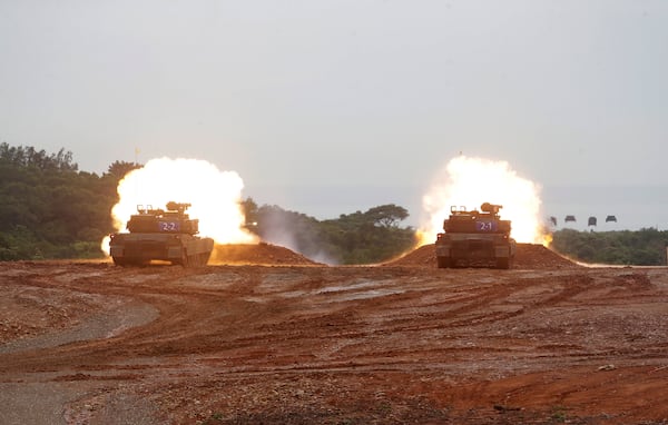 M1A2T Abrams main battle tanks fire during a military live-fire shooting training in Hsinchu County, Taiwan, Thursday, July 10, 2025. (AP Photo/Chiang Ying-ying)