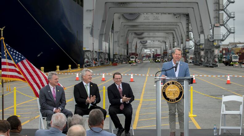 Georgia Gov. Brian Kemp, right, speaks during a visit to the Port of Savannah with Congressmen Sam Graves, center right, Buddy Carter, left, and Mike Collins, center left, at the Georgia Ports Authority's Garden City Terminal, Monday, March, 25, 2024, in Savannah, Ga. Improvements to deepen and widen the harbor are needed before vessels with a capacity greater than 16,000 twenty-foot equivalent container units can call on the port. (GPA Photo/Stephen B. Morton)