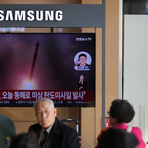 A TV screen shows a reporting of North Korea's ballistic missiles with file footage during a news program at the Seoul Railway Station in Seoul, South Korea, Friday, Nov. 7, 2025. (AP Photo/Lee Jin-man)