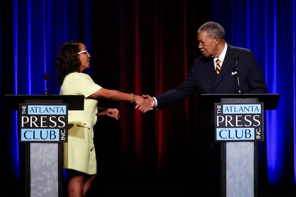 (L-R) Fulton County Commission chair candidates Mo Ivory and Robb Pitts shake hands following the Atlanta Press Club Loudermilk-Young Debate Series at Georgia Public Broadcasting in Atlanta on June 1, 2026. (Arvin Temkar/AJC)
