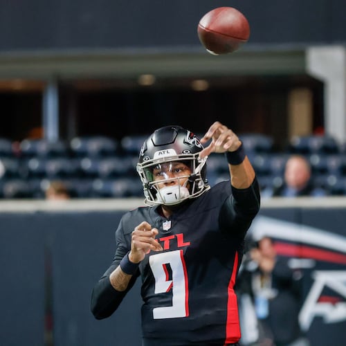 Falcons quarterback Michael Penix Jr. throws the ball during warm-ups before the Atlanta Falcons and Caroline Panthers on Sunday, Jan. 5, 2025, at Mercedes-Benz Stadium. (Miguel Martinez/AJC)