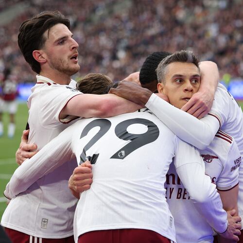 Arsenal players celebrate after scoring during the Premier League soccer match between West Ham and Arsenal in London, Sunday, May 10, 2026. (AP Photo/Ian Walton)