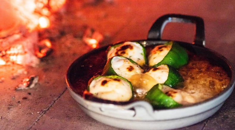 Stuffed Baby Bell Peppers with Goat Cheese & Fennel Pollen-Infused Honey at Brezza Cucina in Ponce City Market. CONTRIBUTED BY HENRI HOLLIS