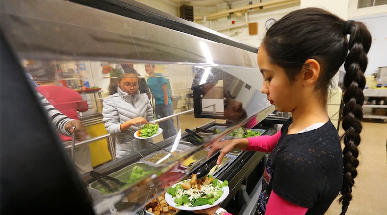 File Photo: Students have a fresh salad bar daily as a lunch option at Atlanta Neighborbood Charter School middle campus in Atlanta. CURTIS COMPTON / CCOMPTON@AJC.COM