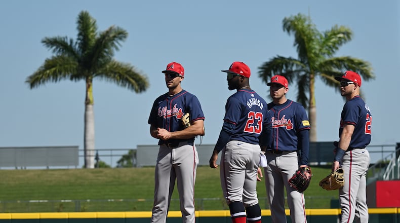 Atlanta Braves first baseman Matt Olson (from left), center fielder Michael Harris II, third baseman Austin Riley and left fielder Jarred Kelenic chat during spring training workouts at CoolToday Park, Friday, Feb. 23, 2024, in North Port, Florida. (Hyosub Shin / Hyosub.Shin@ajc.com)