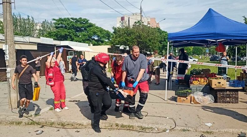 In this photo provided by the Head of Regional Military Administration Ivan Fedorov, paramedics carry an injured person after a Russian strike in Zaporizhzhia, Ukraine, Monday, June 8, 2026. (Telegram Channel of Head of Zaporizhzhia Regional Military Administration Ivan Fedorov via AP)