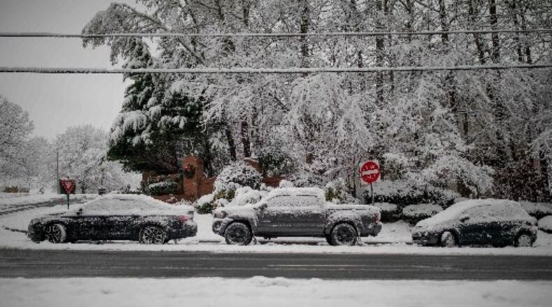 Vehicles sit abandoned on Bells Ferry Road in Acworth after a snowstorm hit Atlanta and North Georgia.
