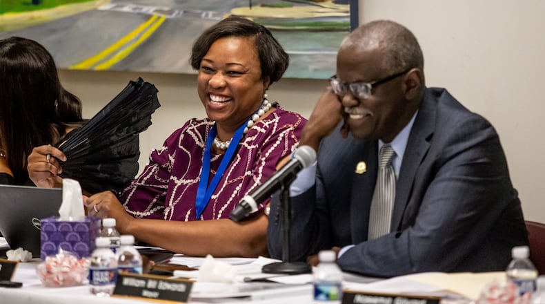 Councilwoman Helen Zenobia Willis (left) and Mayor Bill Edwards react during hearing to remove them from office at the South Fulton City Hall, Dec. 30, 2019. STEVE SCHAEFER / SPECIAL TO THE AJC