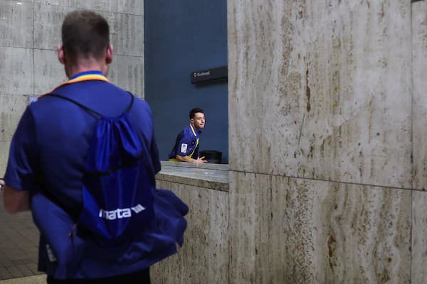 Barbosa sprints through a station to transfer trains while attempting to set a Guinness World Record for the fastest time visiting every MARTA station in Atlanta. (Abbey Cutrer/AJC)