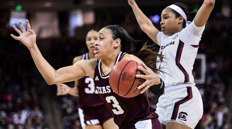 FILE - In this Sunday, March 1, 2020, file photo, Texas A&M guard Chennedy Carter (3) drives against South Carolina guard Zia Cooke (1) during the second half of an NCAA college basketball game in Columbia, S.C. Carter has submitted paperwork to enter the WNBA draft, which is scheduled to be held April 17, 2020. (AP Photo/Sean Rayford, File)
