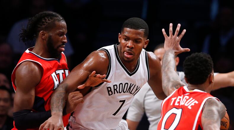 Brooklyn Nets' Joe Johnson (7) works against a double team from Atlanta Hawks' DeMarre Carroll, left, and Jeff Teague (0) during the fourth quarter of an NBA basketball game Wednesday, April 8, 2015, in New York. Atlanta defeated Brooklyn 114-111. (AP Photo/Jason DeCrow) Hawks went 4-0 against Joe Johnson and Brooklyn. (AP photo)