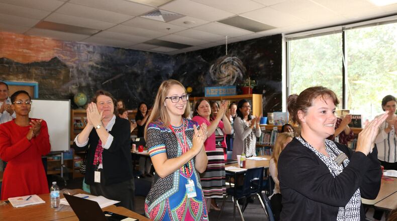A scene from when Powers Ferry Elementary School was awarded a $10,000 check from Micro Center Marietta, which won an Intel competition.