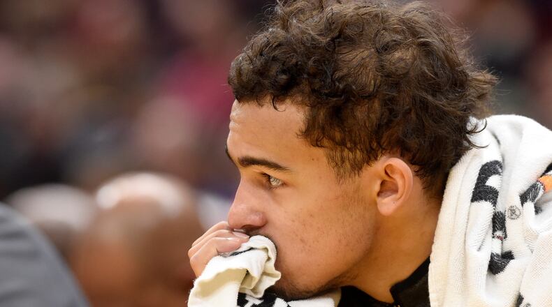 Trae Young  of the Atlanta Hawks watches from the bench during the second half against the Cleveland Cavaliers at Rocket Mortgage Fieldhouse on December 23, 2019 in Cleveland, Ohio. The Cavaliers defeated the Hawks 121-118. NOTE TO USER: User expressly acknowledges and agrees that, by downloading and/or using this photograph, user is consenting to the terms and conditions of the Getty Images License Agreement. (Photo by Jason Miller/Getty Images)