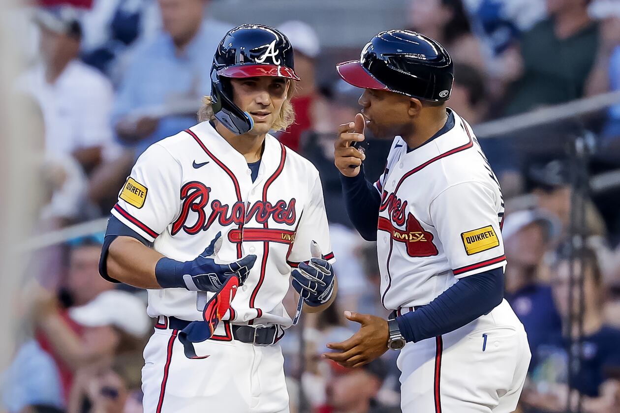 The Braves' Jim Jarvis (left) interacts with first base coach Antoan Richardson after hitting an RBI single against the Mets during the second inning Monday, July 6, 2026, in Atlanta. (Erik S. Lesser/AP)