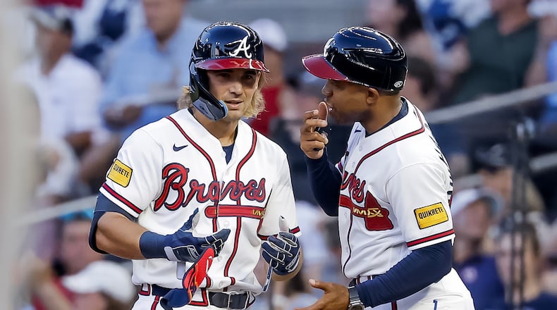 The Braves' Jim Jarvis (left) interacts with first base coach Antoan Richardson after hitting an RBI single against the Mets during the second inning Monday, July 6, 2026, in Atlanta. (Erik S. Lesser/AP)