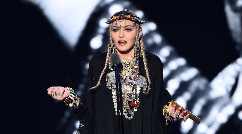 Madonna is delaying her tour due to illness.