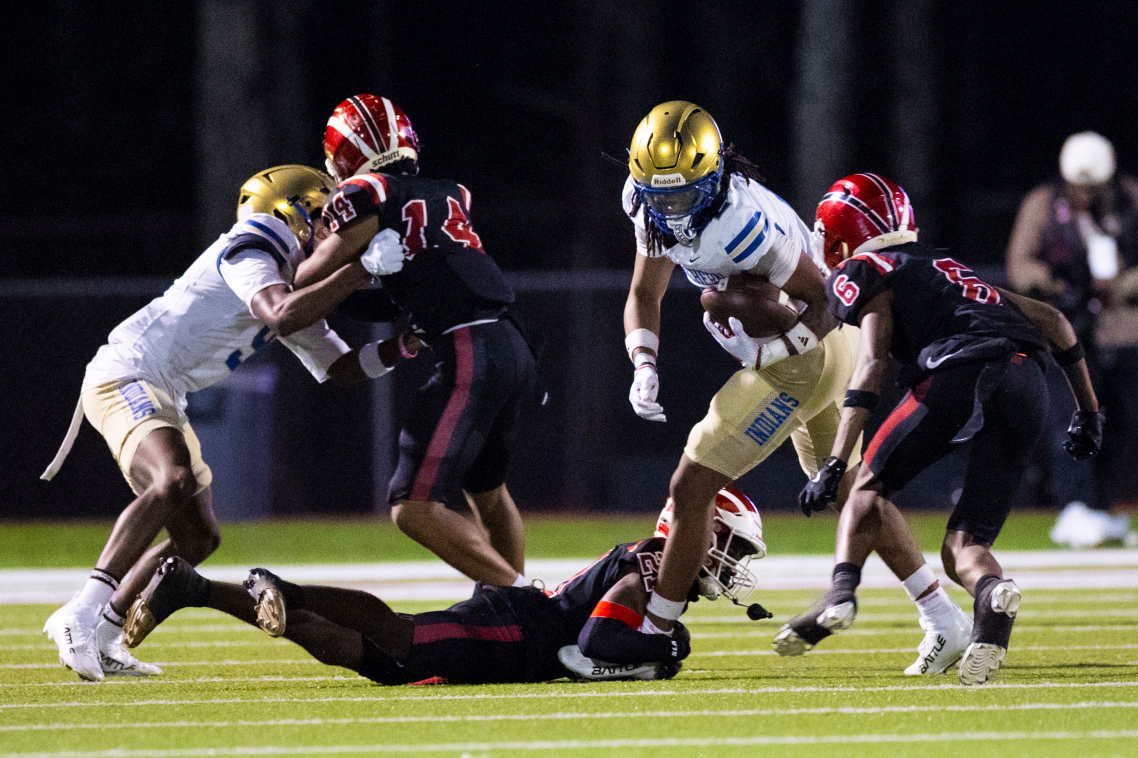 McEachern wide receiver Nalin Scott (2) dodges a tackle against Hillgrove at Cobb Energy Hillgrove Stadium in Powder Springs, GA on Friday, October 17th, 2025. (Oscar Guevara Saenz for the AJC)